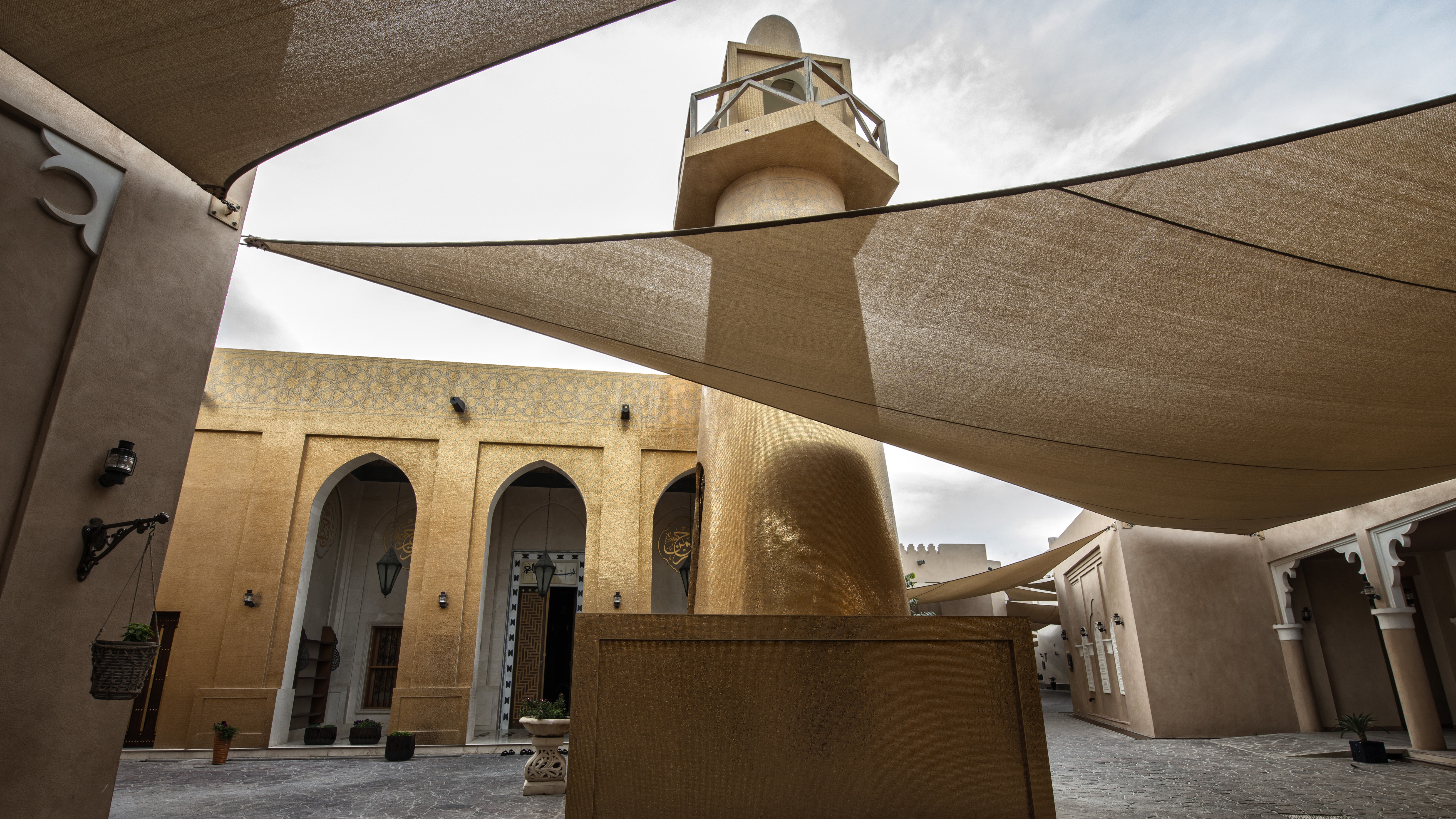 Golden Masjid minaret and courtyard at Katara Cultural Village