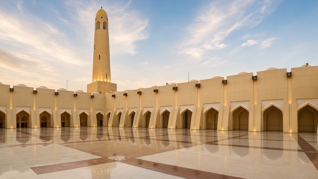 Minaret and domed colonnades inside the Grand Mosque courtyard